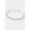 Oliver Bonas Gold Cordelia Multi Flower Casting Curved Lines Gold Plated Bangle -Default Template 2 unnamed file 2089