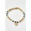 Oliver Bonas Natural Luella Monochrome Beads With Textured Disc Charm Bracelet -Default Template 2 unnamed file 2256