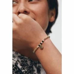 Oliver Bonas Natural Luella Monochrome Beads With Textured Disc Charm Bracelet -Default Template 2 unnamed file 2259