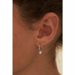 Oliver Bonas Silver Tone Heart Charm Huggie Earrings -Default Template 2 unnamed file 774